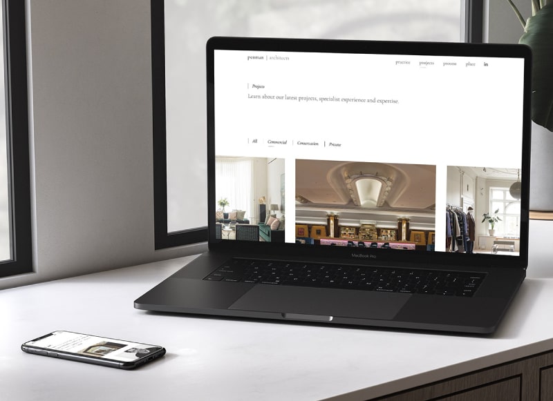 Penman Architect's website on a laptop and mobile device
