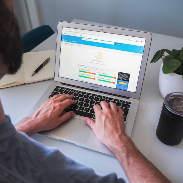 Person on laptop using Google page insights